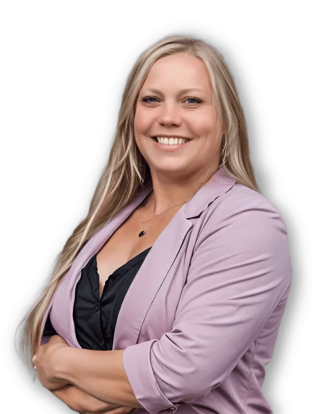 Amanda Kipke, smiling, in a pink blazer with her arms folded